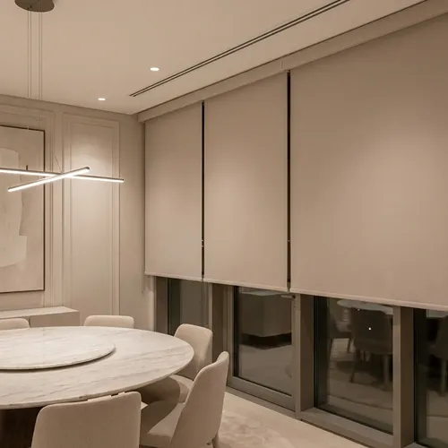 Modern dining area with elegant roller blinds in Dubai